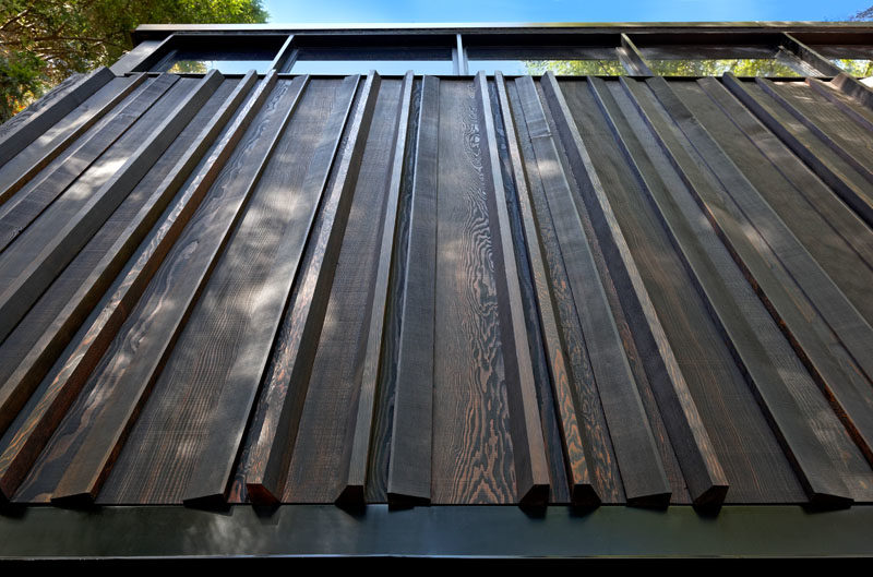 Siding Ideas - Douglas Fir was chosen for the upper portion of this modern house as it adds warmth and ubiquitous heritage in Ontario cottage country. #WoodSiding #DouglasFir #BoatHouse #Architecture