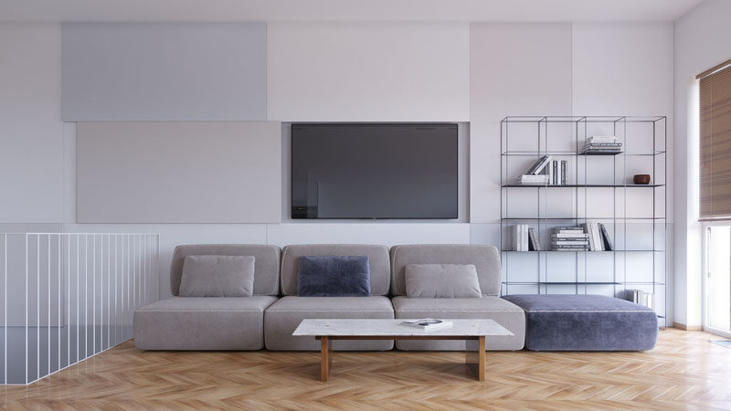 Living Room Ideas - This modern living room has decorative panels on the wall, that when one is slid open, it reveals the television. #HideTelevision #LivingRoomIdeas #InteriorDesign