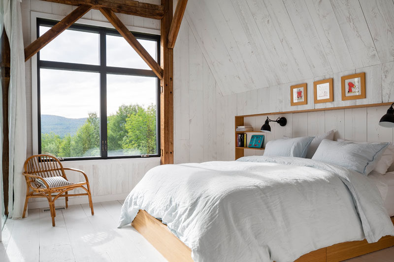 Bedroom Ideas - The bedrooms in this modern barn have whitewashed wood walls and floors, and large windows that provide treetop views. #ModernBarn #ModernBedroom #BedroomIdeas