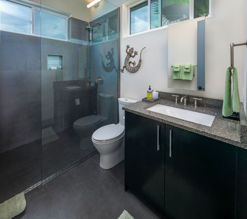 Bathroom Ideas - Windows around the top of this small bathroom room provide natural light, while a glass shower screen allows the light to travel throughout the room. #BathroomDesign #SmallBathroom