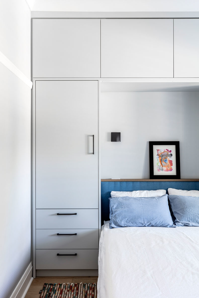 Bedroom Ideas - This modern bedroom has built-in cabinets that provides much needed storage as there isn't a separate closet in the room. #BedroomStorage #BedroomIdeas #BedroomDesign #BedroomCloset