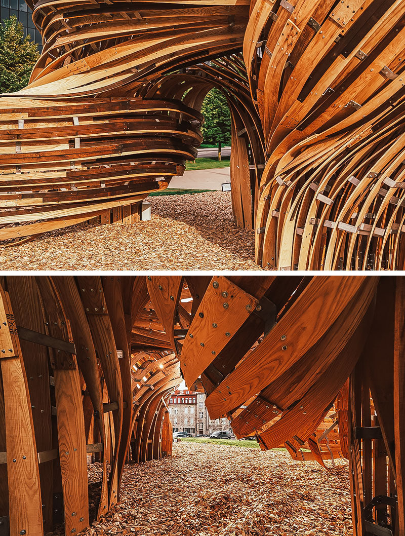 Sculpture Ideas - Using analogue tools augmented with the precision of mixed reality environments, the designers of this modern sculpture were able to create the curved shape that makes the wood appear as if it's flowing. #Sculpture #PublicArt