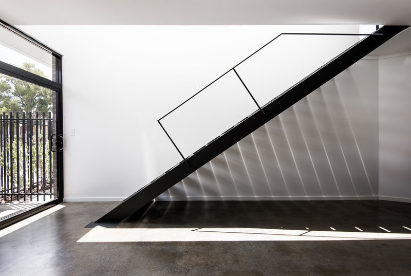 Stair Ideas - A window above these stairs allows the light to create angled shadows on the wall below. #Stairs #StairDesign