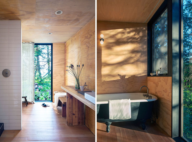 Bathroom Ideas - A reclaimed cast iron tub in the master bath creates the feeling of soaking in the outdoors. #BathroomIdeas #Cabin