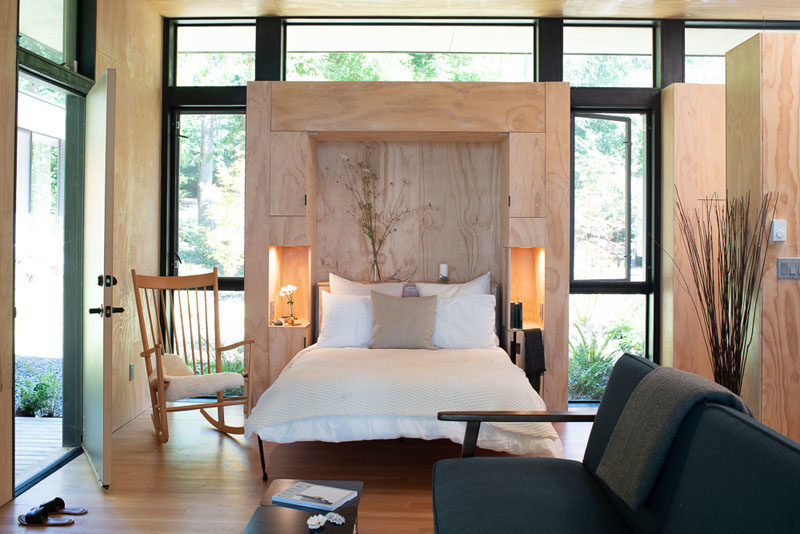 Bedroom Ideas - This built-in murphy bed in the allows the cabin to be a flexible sleeping area when needed. #MurphyBed #Cabin #ModernBedroom #Windows