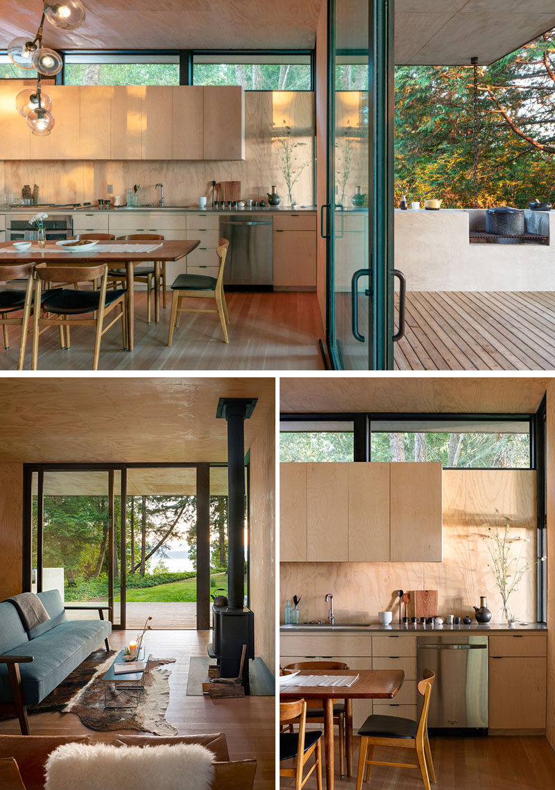 The design of this modern cabin include an indoor outdoor kitchen that has a pass-through window that extends the interior countertop into the outdoor concrete counter and built in wood barbeque. #ModernCabin #KitchenDesign #OutdoorKitchen #BBQ