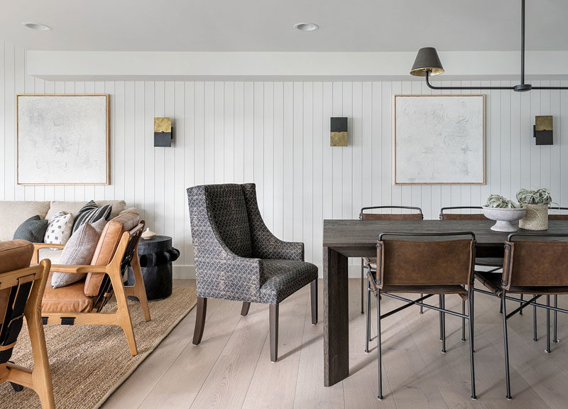 Dining Room Ideas - This dining room shares the same space as the living room, and is anchored in the open floor plan by a horizontal light feature. #DiningRoomIdeas #DiningRoom