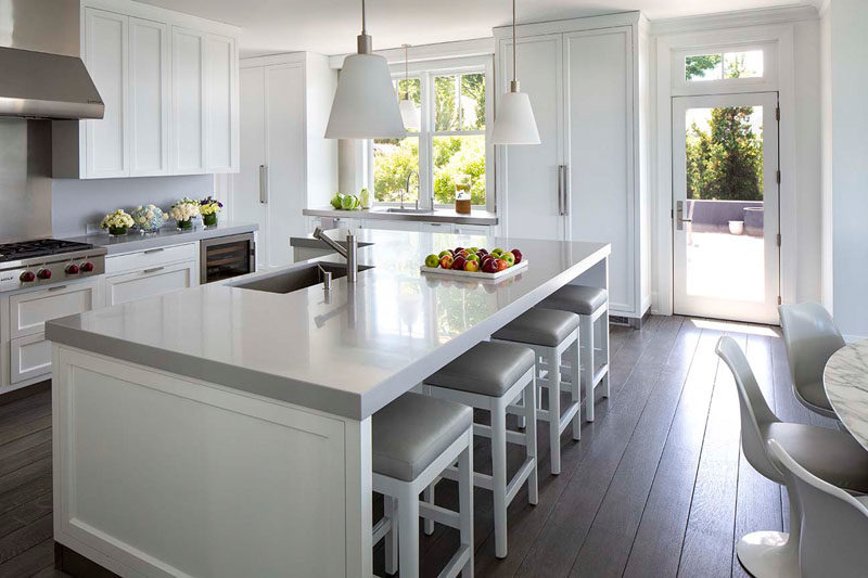 Kitchen Ideas - In this contemporary kitchen, the grey and white color palette keeps the interior bright and open. #KitchenIdeas #KitchenDesign #GreyAndWhiteKitchen