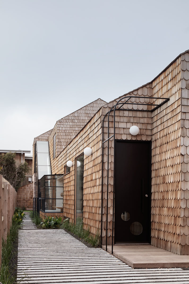 Mani Architecture has designed a modern cottage-like house in Melbourne, Australia, that's covered in wood shingles.  #Shingles #ModernHouse #HouseDesign #Architecture