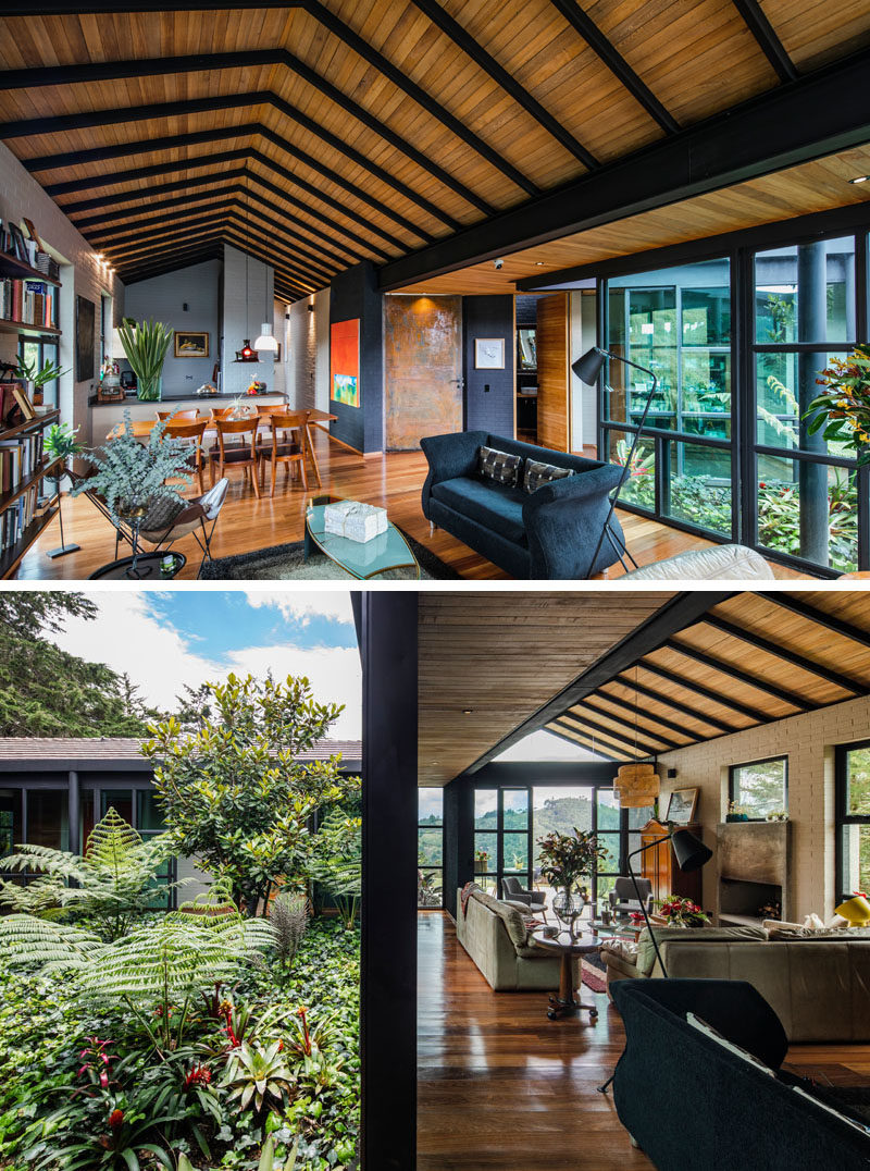 A central open-air garden filled with plants connects the wings of this modern house, with sliding glass walls opening the garden to the interior. #Garden #ModernHouse #Architecture #InteriorGarden #Landscaping