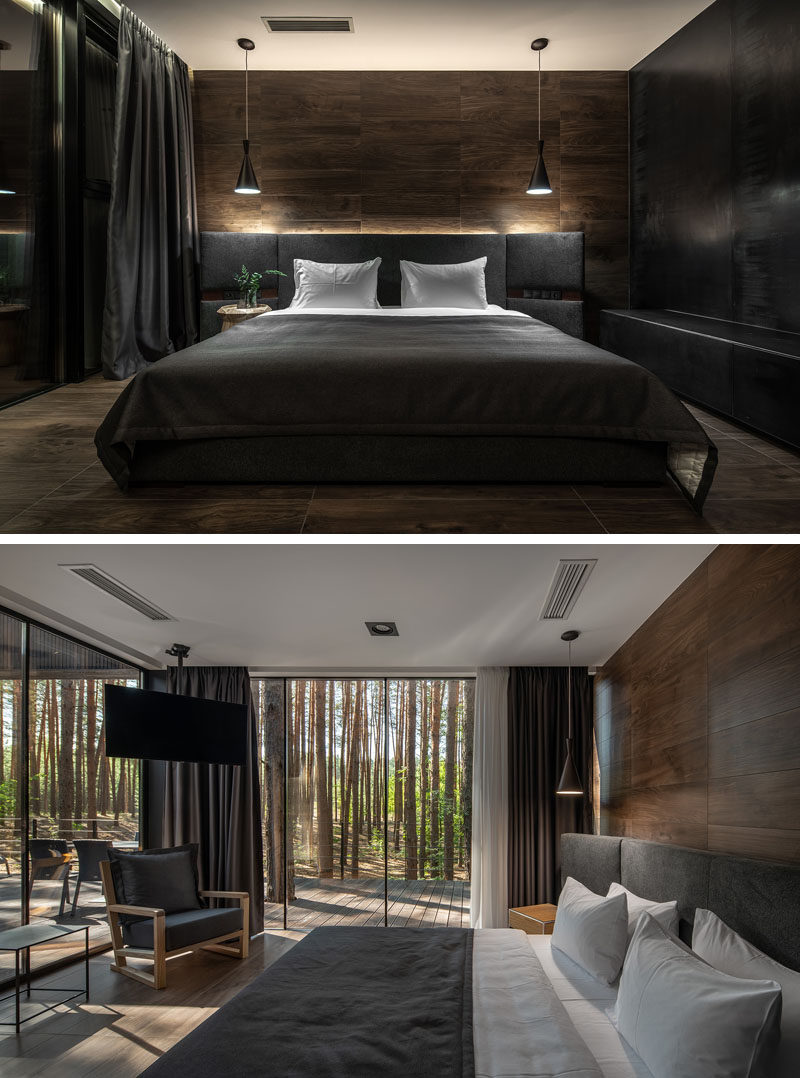 Bedroom Ideas - In this modern bedroom, a wood accent wall becomes the backdrop for the grey bed, while floor to ceiling windows showcase the tree views. #ModernBedroom #BedroomIdeas #WoodAccentWall