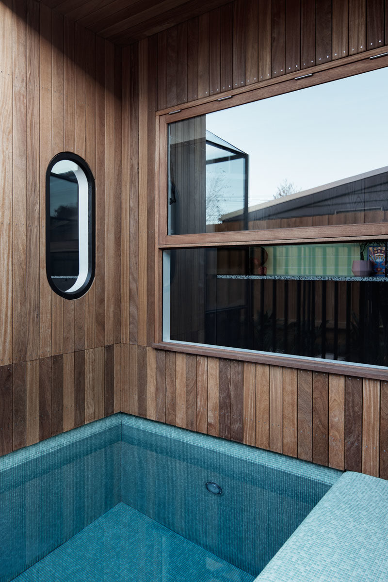 Swimming Pool Ideas - A blue-tiled plunge pool has been built into a small alcove at the side of this modern house. #PlungePool #SwimmingPool #Architecture #Windows