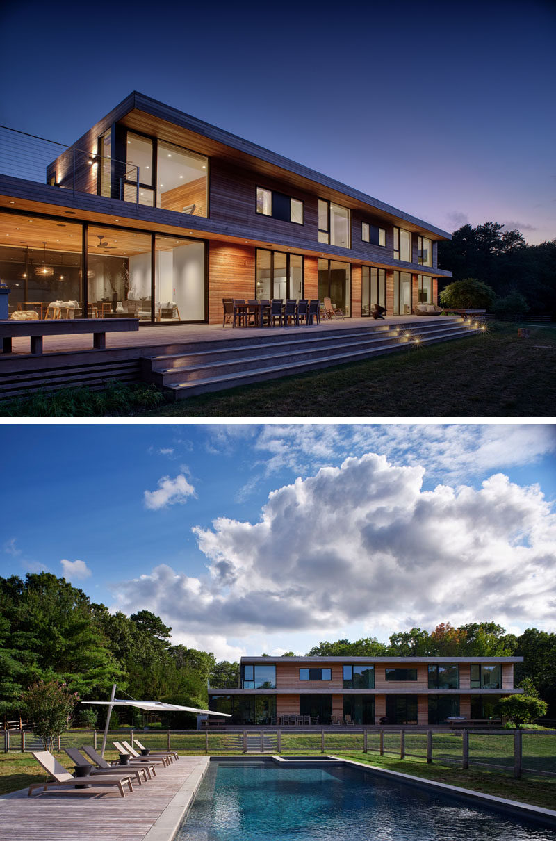 Landscaping Ideas - This modern wood house has steps from the patio that lead to a large grassy area, that then leads to the swimming pool and a pool house. #Landscaping #Patio #OutdoorSteps #SwimmingPool