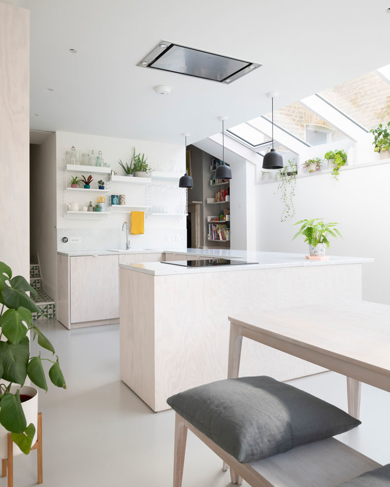 Kitchen Ideas - This modern kitchen has whitewashed Douglas Fir cabinets, an enamel splatterware worktop, and a plant shelf that runs the length of this new extension. #ModernKitchen #WhitewashedWood #PlantShelf