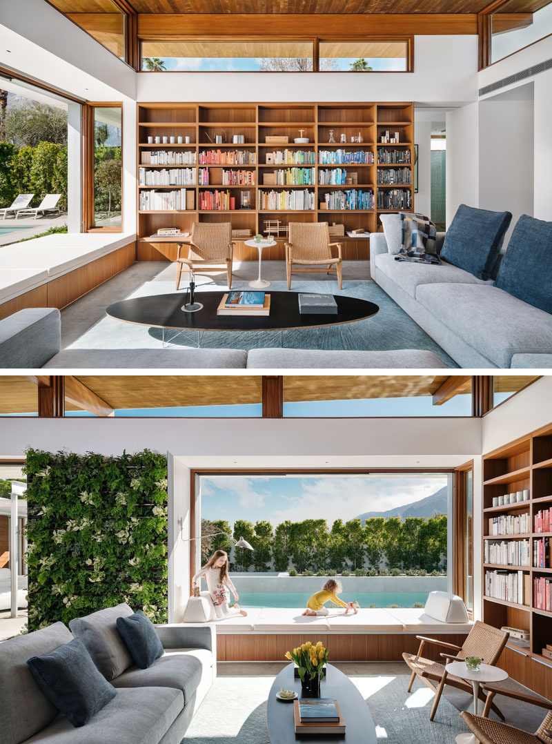 Living Room Ideas - In this modern living room, custom cabinetry lines the wall, while a window seat connects to the outdoor space. #LivingRoomIdeas #ModernLivingRoom #WoodBookshelf #WindowSeat