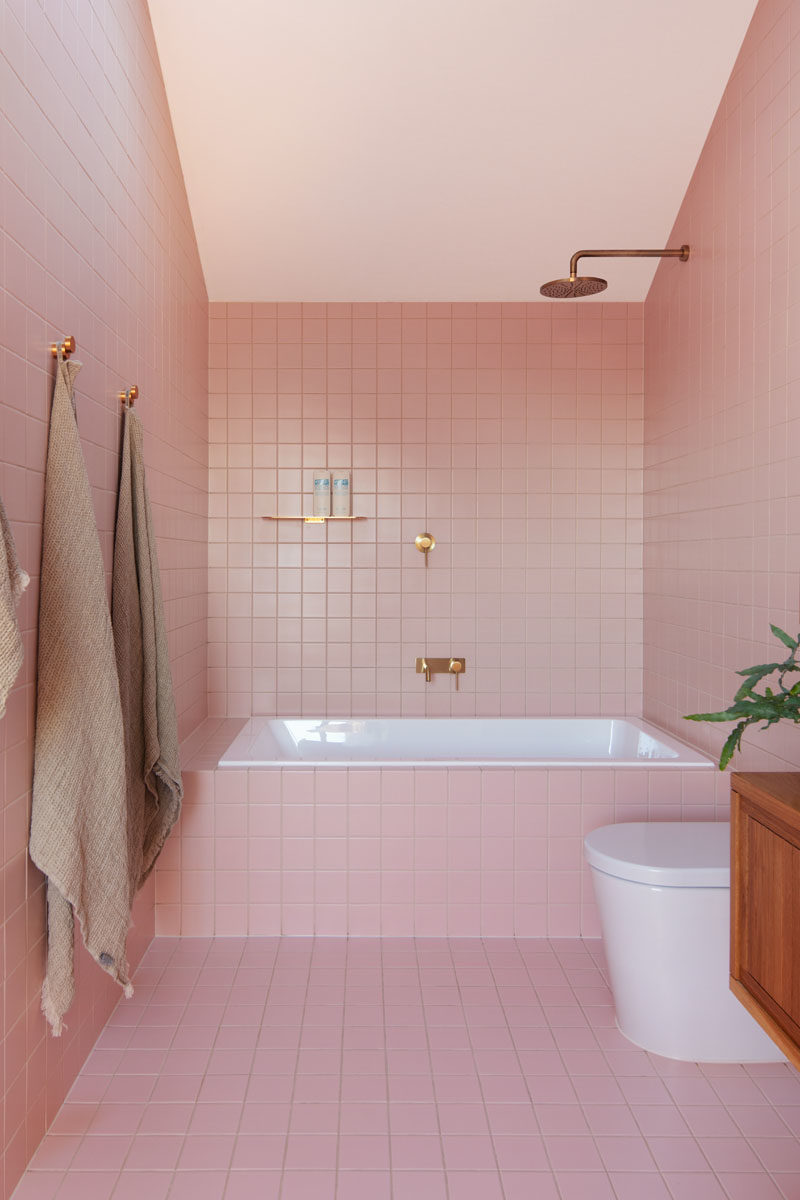 Bathroom Ideas - This modern pink bathroom adds a fun and soft pop of color to the interior. #PinkBathroom #BathroomIdeas #ModernBathroom #BathroomDesign