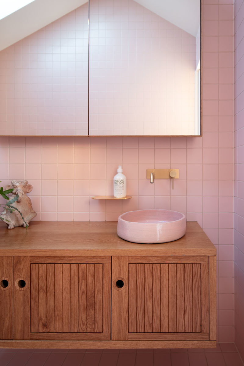 Bathroom Ideas - This modern pink bathroom adds a fun and soft pop of color to the interior. #PinkBathroom #BathroomIdeas #ModernBathroom #BathroomDesign