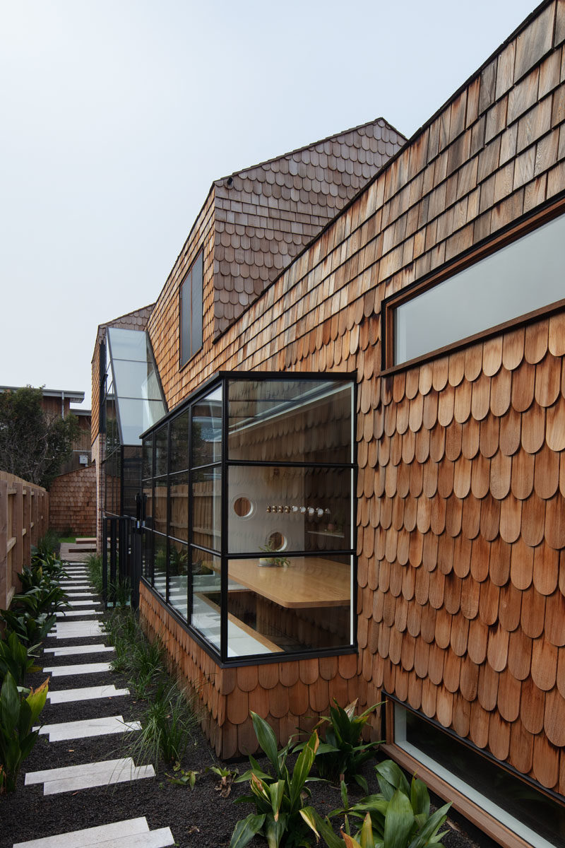 Landscaping Ideas - A small stepping stone path along the side of this modern shingle covered house, leads to a plunge pool, and connects to the front garden. #Path #GardenPath #Landscaping #Shingles #HouseDesign