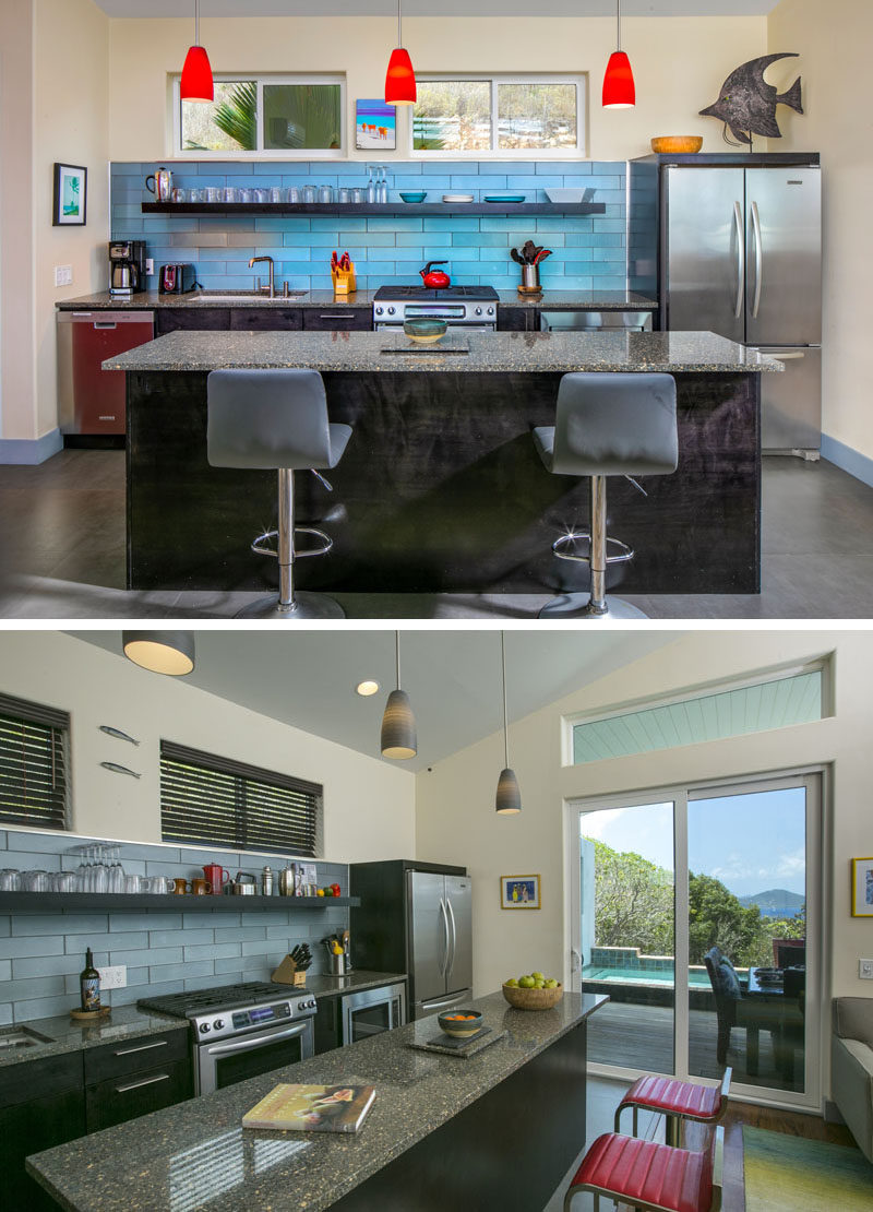 Kitchen Islands - The kitchen island in this modern cottage doubles as a dining area, while the blue tiles form a backdrop for the long floating shelf. #KitchenDesign #SmallKitchen