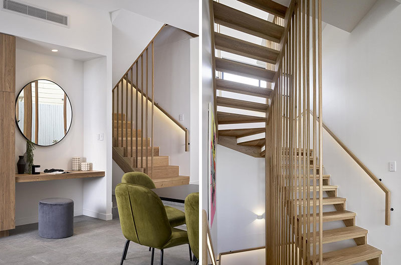 Stair Ideas - Hidden lighting built into the handrail of these modern wood stairs, makes it easy to use them at night. #WoodStairs #ModernStairs #StairDesign #Handrail