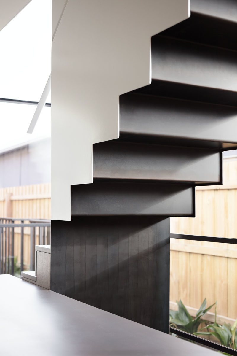 Stair Ideas - This modern staircase runs alongside a wall of windows, helping to fill the interior with plenty of natural light. #Stairs #Windows #ModernStairs #StairIdeas #StairDesign