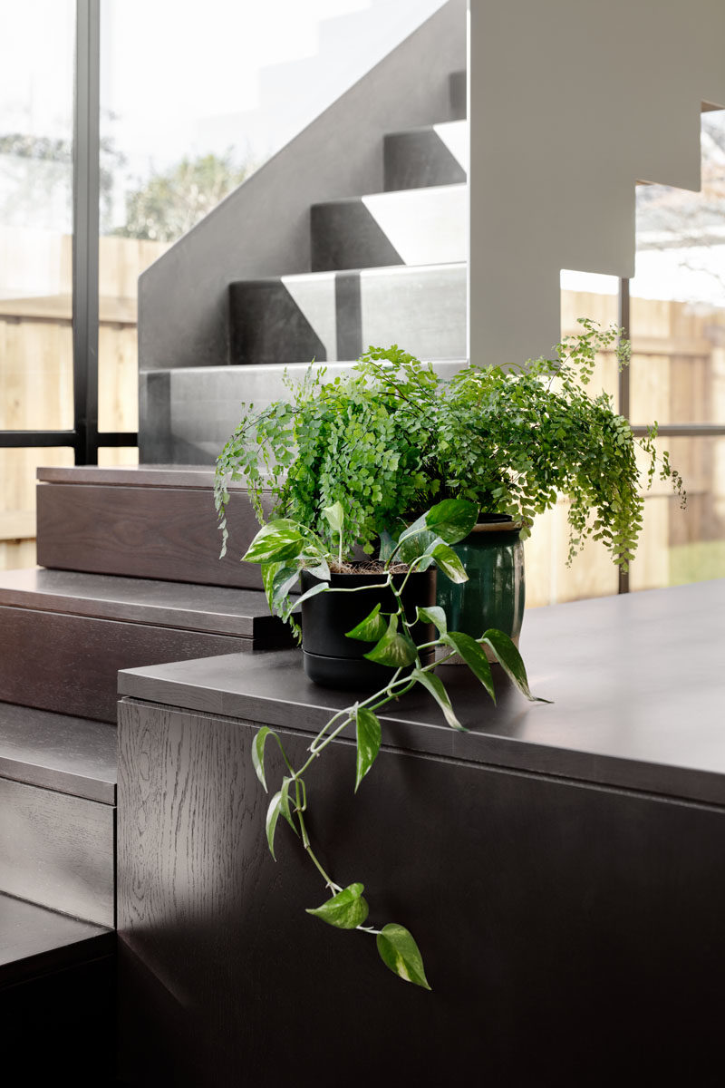 Stair Ideas - This modern staircase runs alongside a wall of windows, helping to fill the interior with plenty of natural light. #Stairs #Windows #ModernStairs #StairIdeas #StairDesign