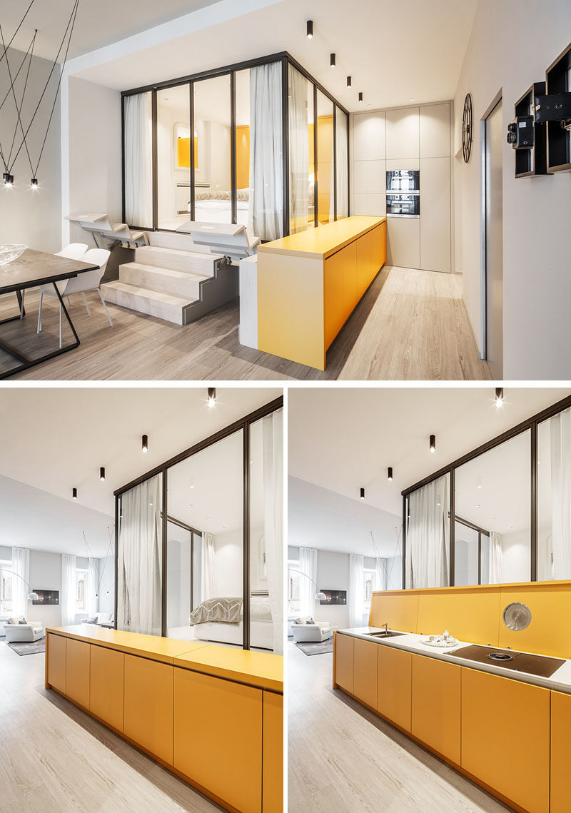 Small Apartment Ideas - Upon entering this small apartment, there's a long yellow sideboard that greets visitors, however the top of the sideboard can be lifted to reveal the kitchen counter, that has a sink and a cook top, with the 'lid' also acting as a backsplash. #SmallApartment #SmallApartmentIdeas #HiddenKitchen #KitchenIdeas