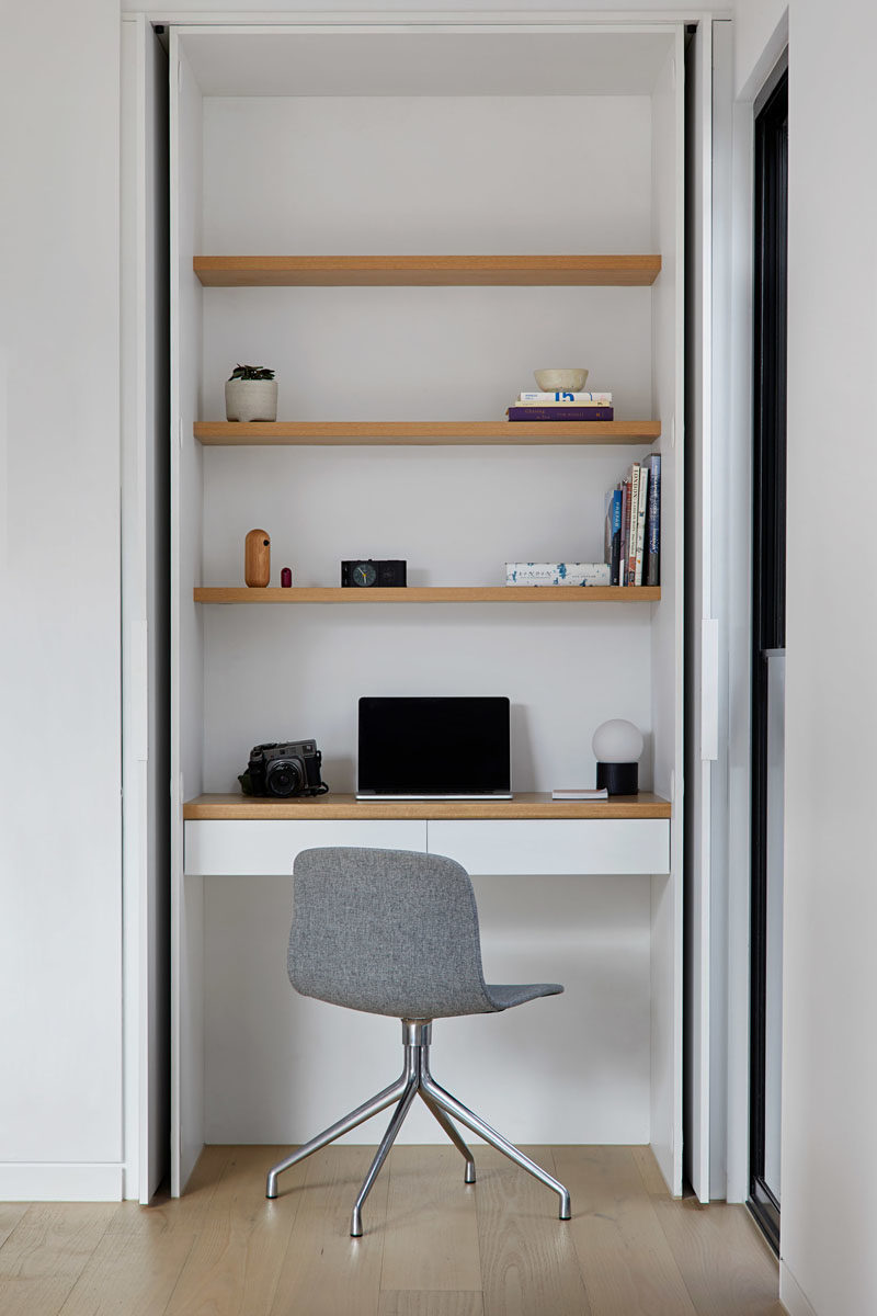 Home Office Ideas - This modern house has a small home office with wood shelving, that's hidden within a closet. #HomeOffice #SmallHomeOffice