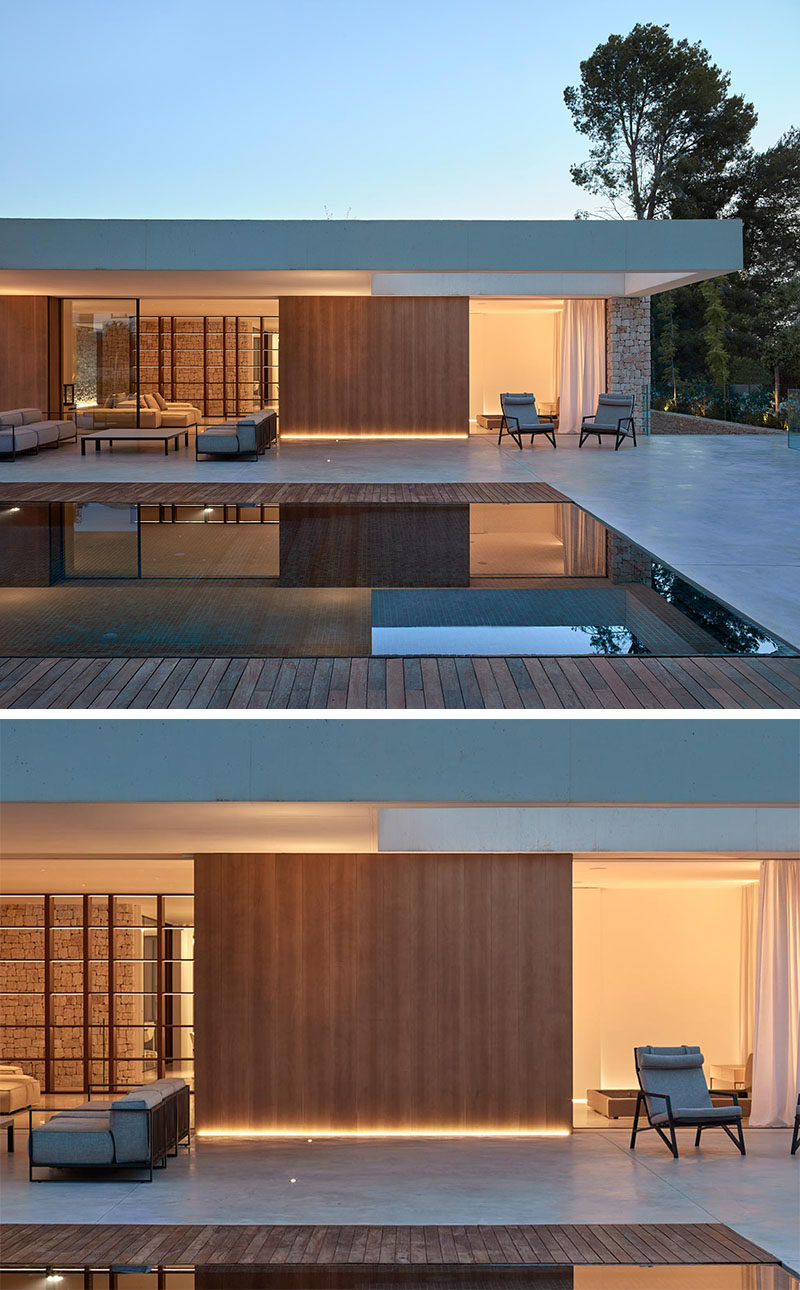 Exterior Lighting Ideas - By including strips of hidden lighting at the base of the exterior wood walls, the architect was able to highlight the wood accents, and create a soft glow that can be enjoyed at nighttime when entertaining by the pool. #ExteriorLighting #OutdoorLightingIdeas #Landscaping