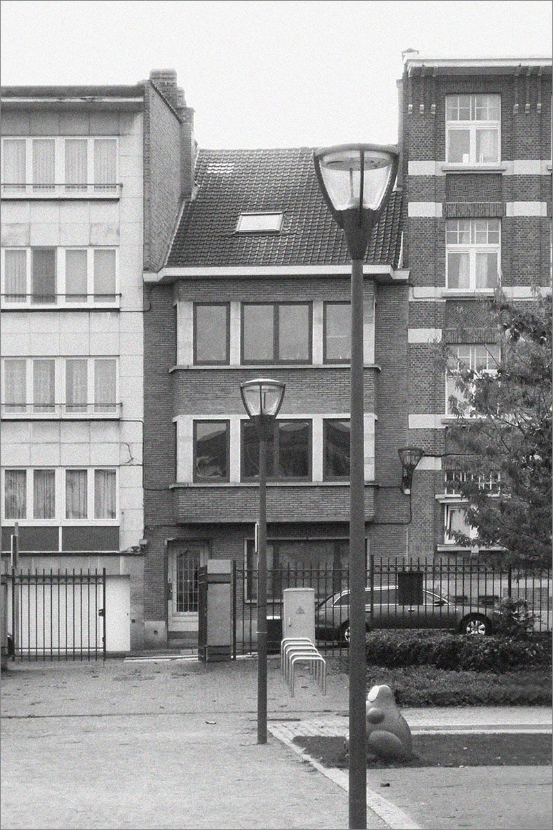 BEFORE - Atelier Tom Vanhee has renovated the top of a building in Brussels, Belgium, and transformed it into a modern rooftop home that spreads over two floors.