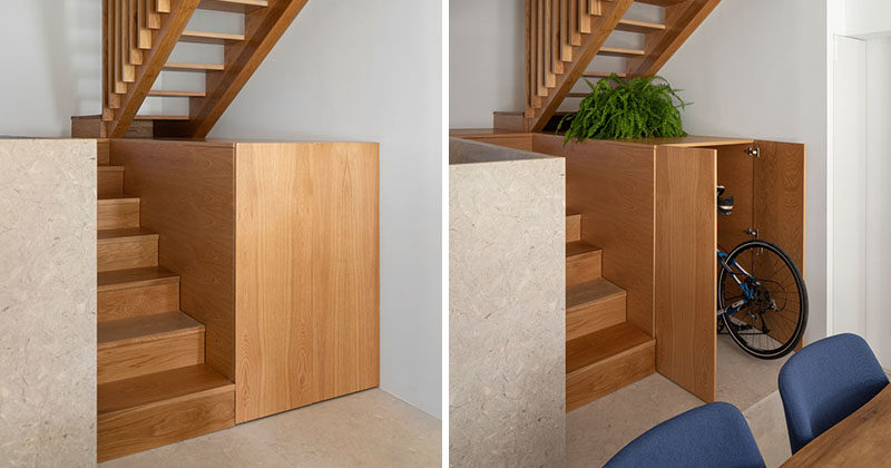 Storage Ideas - This small house includes a cabinet underneath the stairs that runs the depth of the stairs. The cabinet is large enough to hide a bike, and provides a place to display decorative items and plants. #HiddenStorage #UnderStairStorage #BikeStorage #InteriorDesign #StairDesign #StorageIdeas