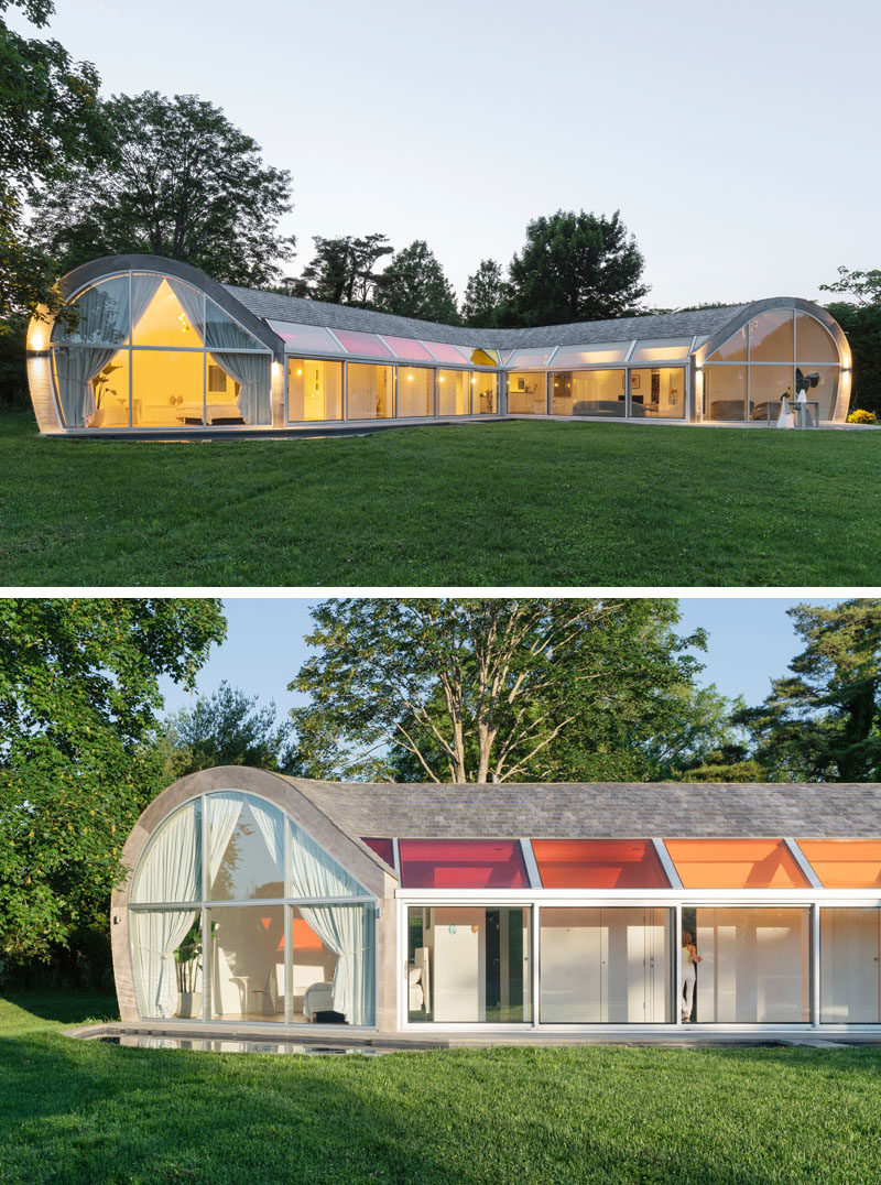 Window Ideas - Colorful skylights range from vermilion red to deep yellow, and provide a pop of color for this curvaceous modern house. #Skylights #WindowIdeas #ColorfulWindows #Architecture #ModernArchitecture