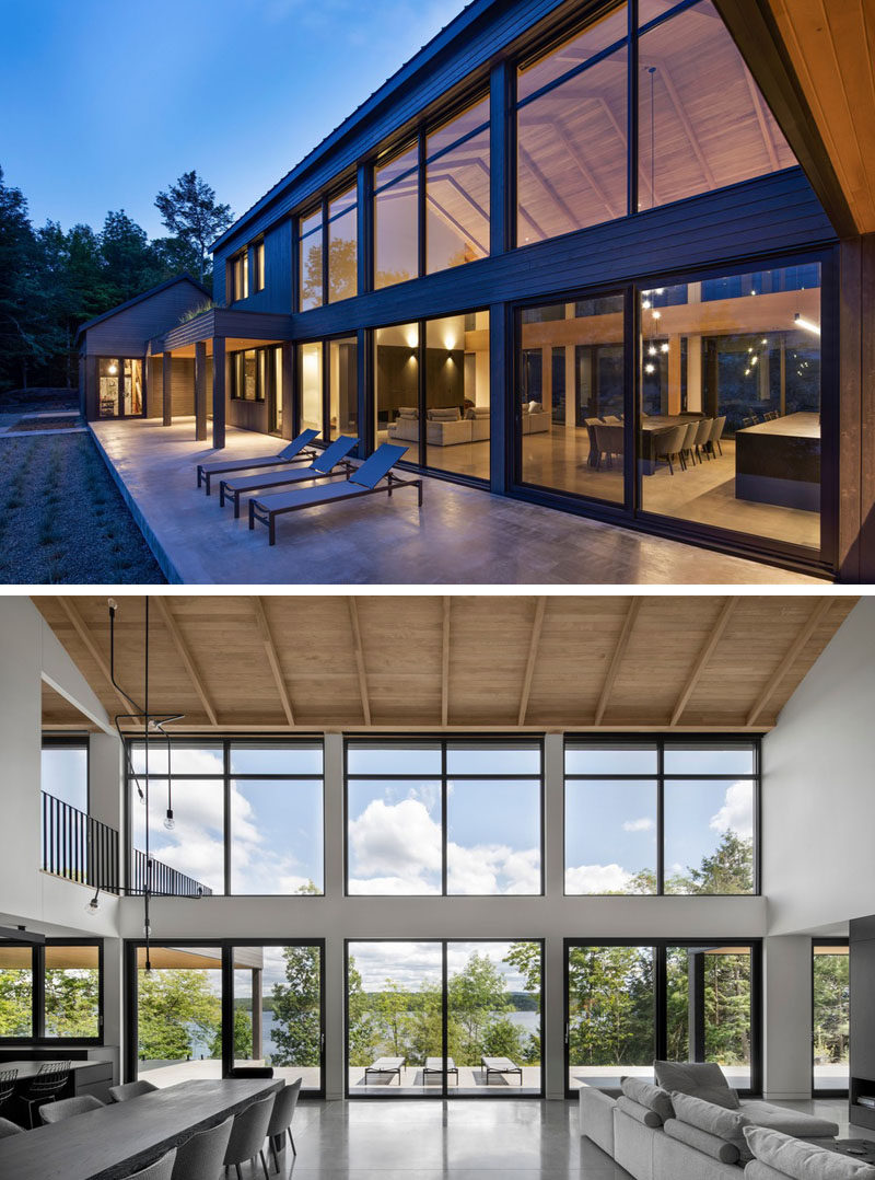 Window Ideas - This modern barnhouse has a large open-plan great room that's lined with a wall of windows. #ModernBarnhouse #Windows #ModernArchitecture