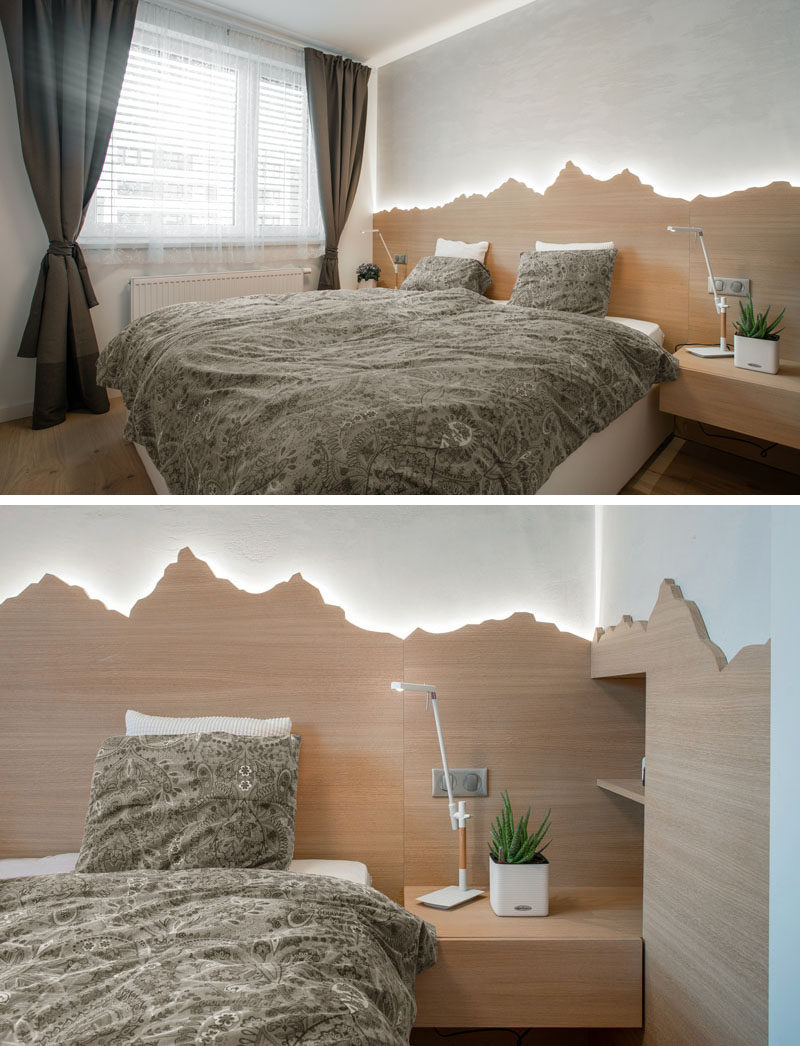 Headboard Ideas - In this modern bedroom, there's a custom backlit wood headboard that showcases the outline of mountains. #HeadboardIdeas #ModernBedroom #BacklitHeadboard #BedroomIdeas