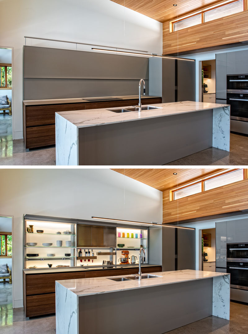 Kitchen Ideas - In the kitchen of this modern cottage, the backlit cabinets by Valcuccine, connects with a walk-in pantry and outdoor barbecue area, creating an optimal chefs kitchen. #ModernKitchen #BacklitCabinets #KitchenDesign