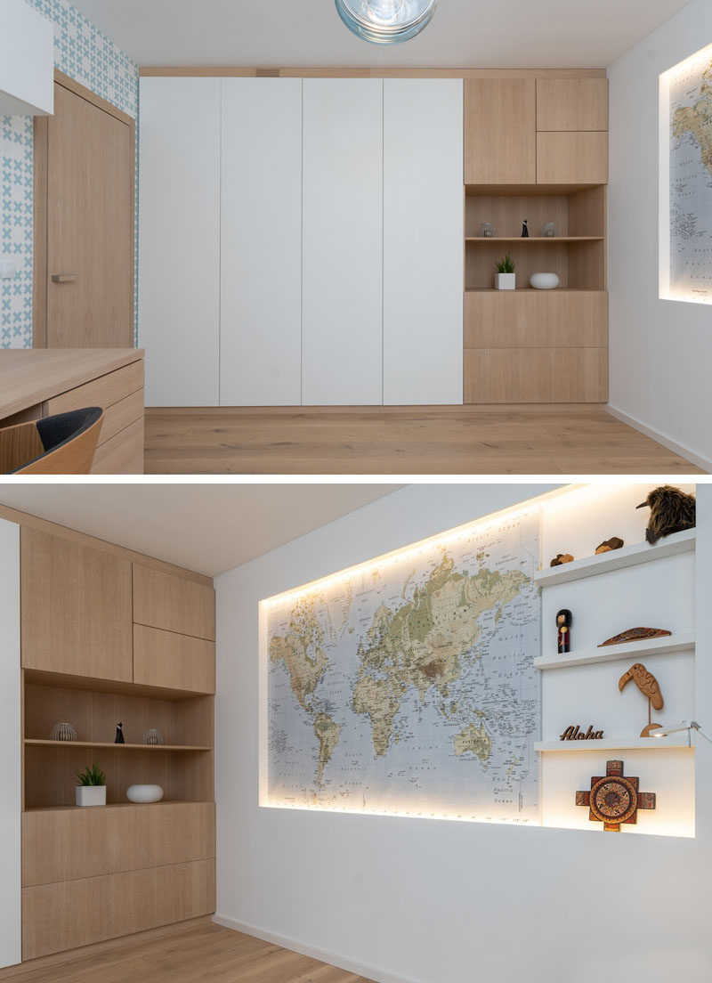 Home Office Ideas - This modern office features a recessed world map and minimal shelving that's surrounded by hidden lighting, creating an eye-catching focal point for the room. #ModernHomeOffice #WorldMap #AccentWall #HomeOfficeIdeas