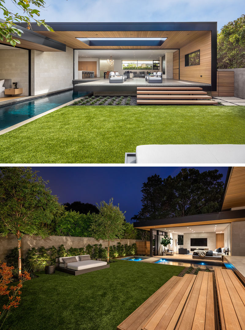 The partially covered patio of this modern house steps down to the yard, where there's a daybed, and a pool with a spa.