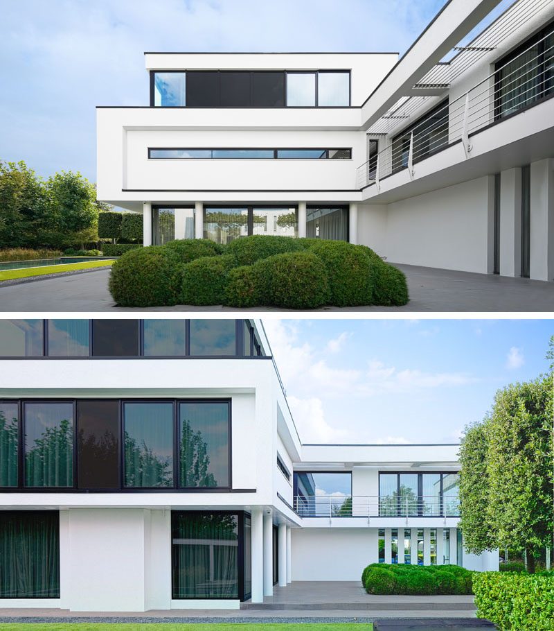 Large and uniquely shaped windows are used in the design of this modern house, to give either privacy or an uninterrupted view of the surrounding greenery. #Windows #ModernHouse #ModernArchitecture