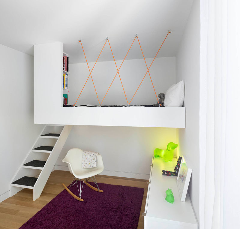 Kids Bedroom Ideas - This modern kid's bedroom has a custom loft bed with a built-in library, that allows the floor to be free to playing and reading. #KidsBedroomIdeas #BedroomIdeas #ModernBedroom