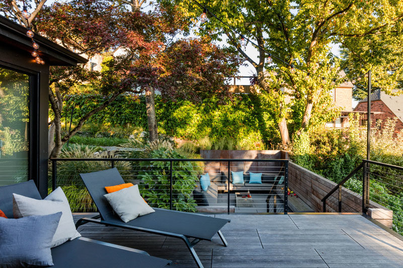 A Ipe hardwood deck with a pair of lounge chairs.