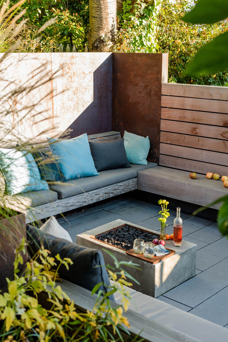 Landscaping Ideas - This sunken courtyard features custom hardwood screens, plate steel retaining walls, ipe wood benches, and handmade cushions by La Fabrique. #LandscapingIdeas #GardenIdeas #OutdoorSpace #Courtyard #OutdoorSeating #GardenIdeas