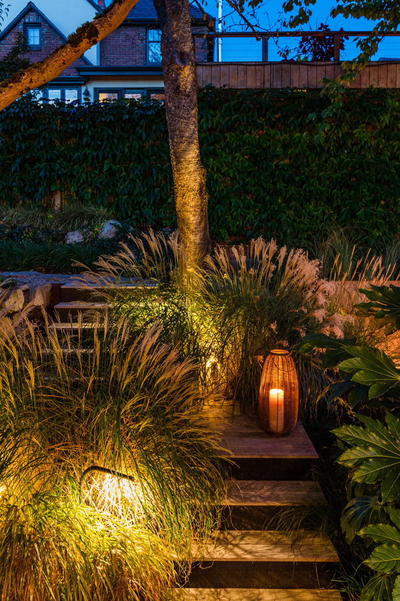 Landscaping Ideas - This modern garden features steel and wood steps, that are surrounded by billowing grasses.   #LandscapingIdeas #GardenIdeas #OutdoorSteps #OutdoorStairs