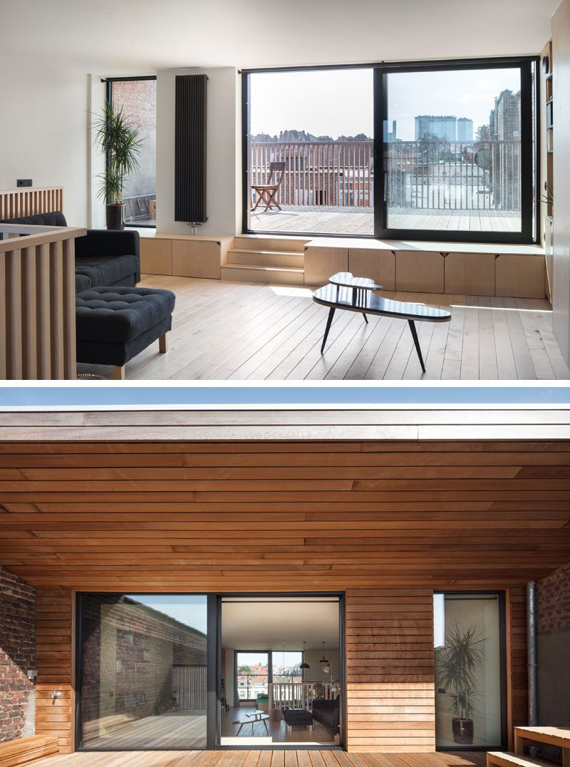 The upstairs of this modern house has a work or play area at the front of the home and a sitting area with a sun terrace at the back. #ModernHouse #HouseDesign #Balcony #Terrace