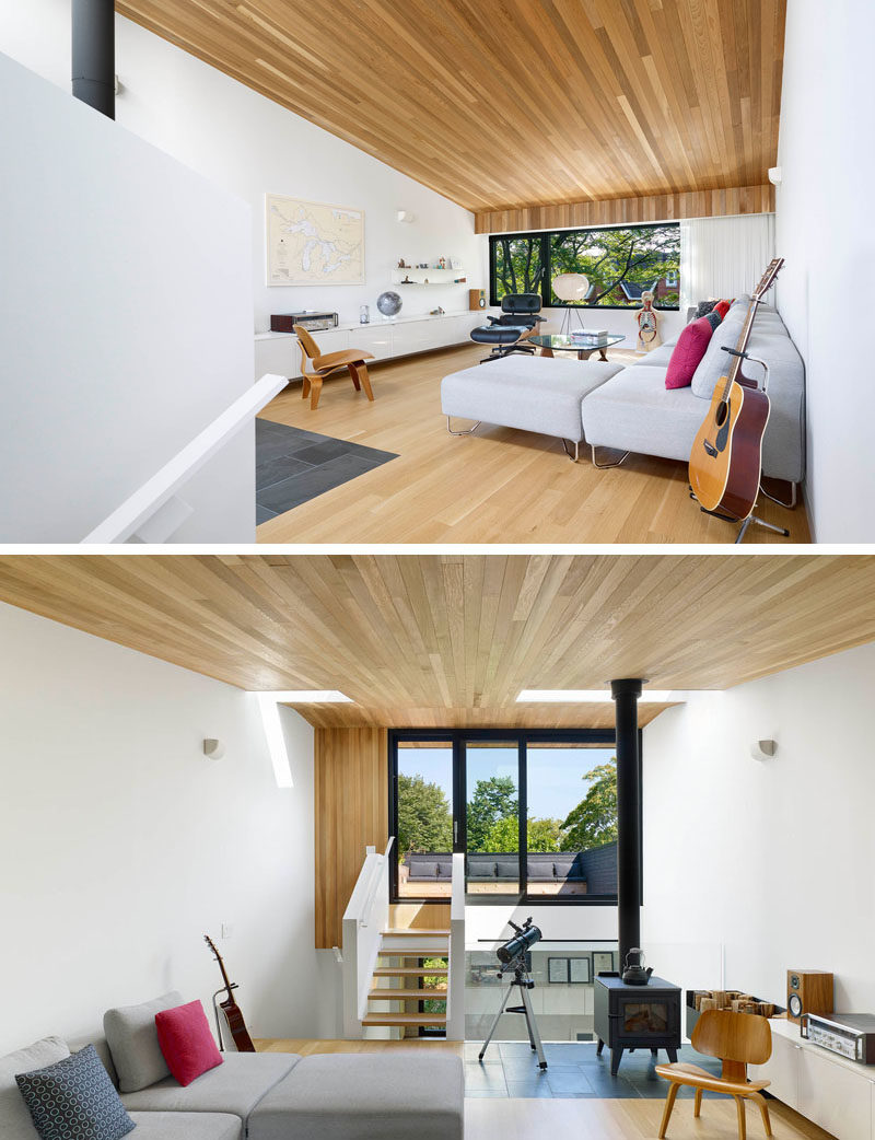 Living Room Ideas - This modern  living room has been designed as an urbanized version of a cabin in the woods, with wood stove and cedar ceiling. #LivingRoomIdeas #ModernLivingRoom #WoodCeiling