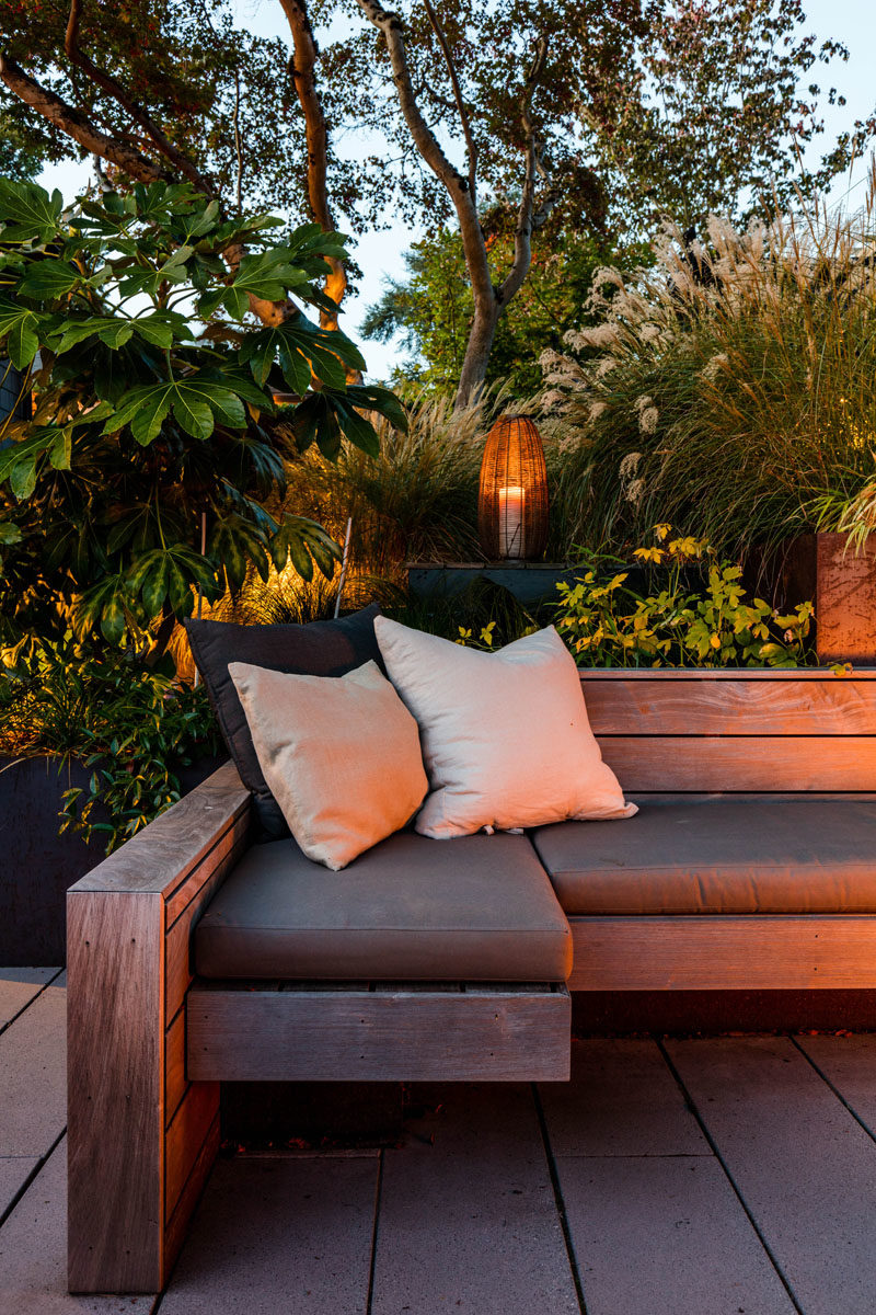 Landscaping Ideas - This sunken courtyard features custom hardwood screens, plate steel retaining walls, ipe wood benches, and handmade cushions by La Fabrique. #LandscapingIdeas #GardenIdeas #OutdoorSpace #Courtyard #OutdoorSeating #GardenIdeas