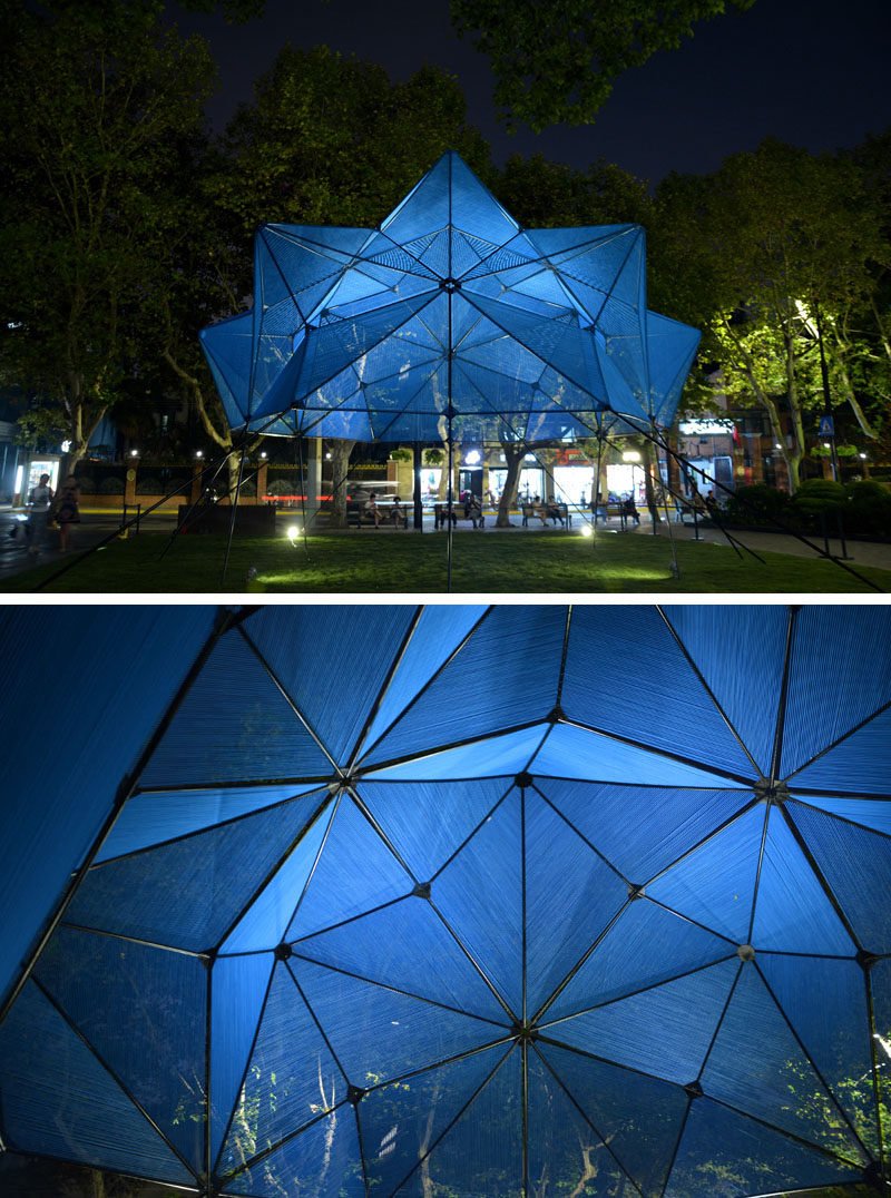 This modern public art installation named 'Cobalt Muffin', has a geometric shape that floats over a lawn, with the design made from 60 similar triangles, that have been covered with a semi-transparent skin made from more than 4 miles (7.5 km) of elastic ropes, creating a vibrant addition to the area. #ModernArt #ArtInstallation #PublicSculpture