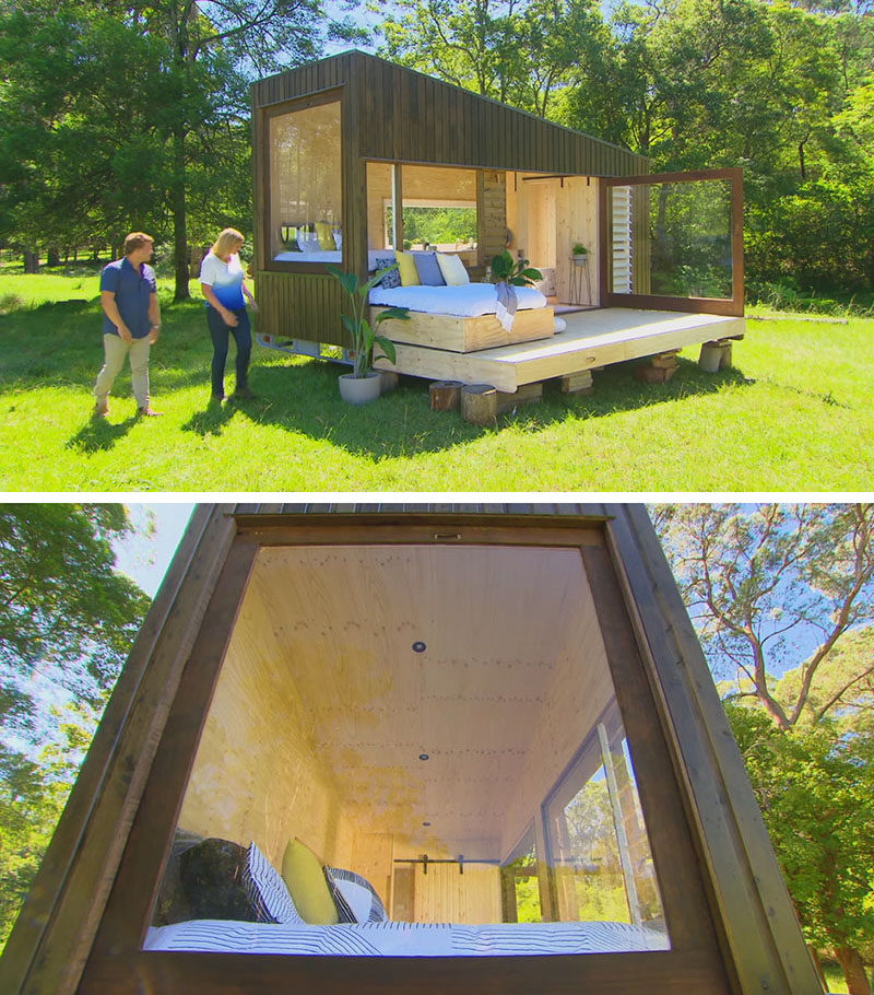TIny House Ideas - This tiny house, which measures in at just 19 feet x 7 feet (6m x 2.4m), has a simple modern design that covered in cypress pine cladding. Two siding doors were used to create the large picture window on the end of the house, while a large pivoting glass door opens the interior to the deck. #TinyHouseIdeas #ModernTinyHouse #TinyHouseDesign