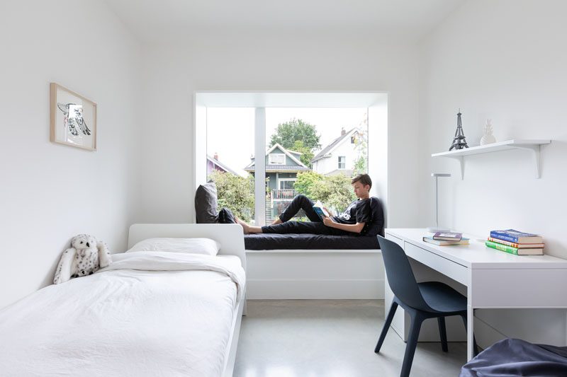 In this modern teen's bedroom, the bay window includes a comfortable window seat with views of the neighborhood. #WindowSeat #ModernBayWindow #BedroomIdeas