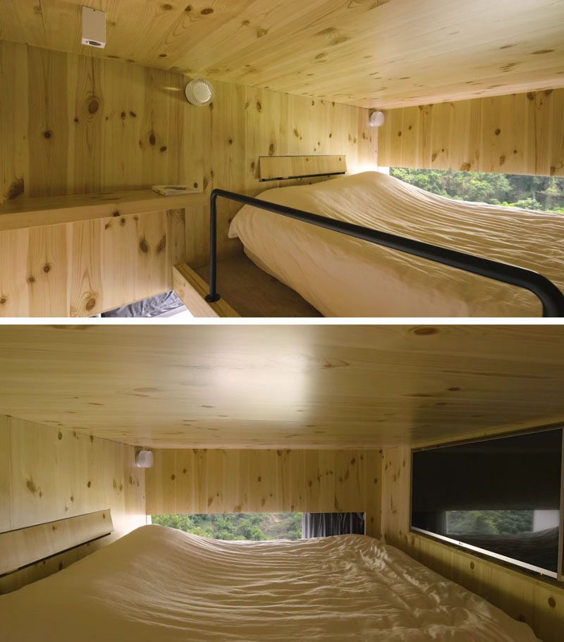 A box-loft sleeping area above the dining room in this small apartment, is clad in natural pine and seems to float like a tree house, with a window that provides views of the forest outside. #LoftedBedroom #BedroomLoft #SmallApartment #InteriorDesign