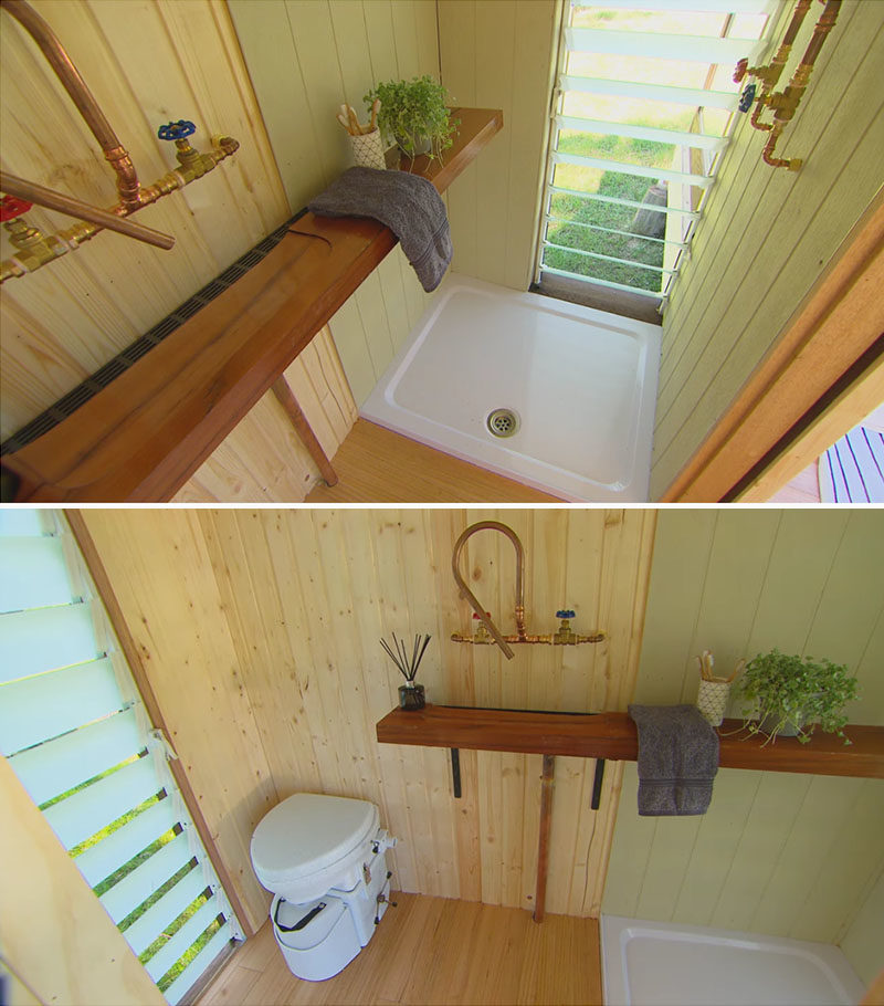 Tiny House Ideas - Hidden behind a sliding barn door is the bathroom, where louvre windows on each end on the room provide natural light and fresh air. #TinyhouseIdeas #SmallHouse #TinyBathroom #Windows